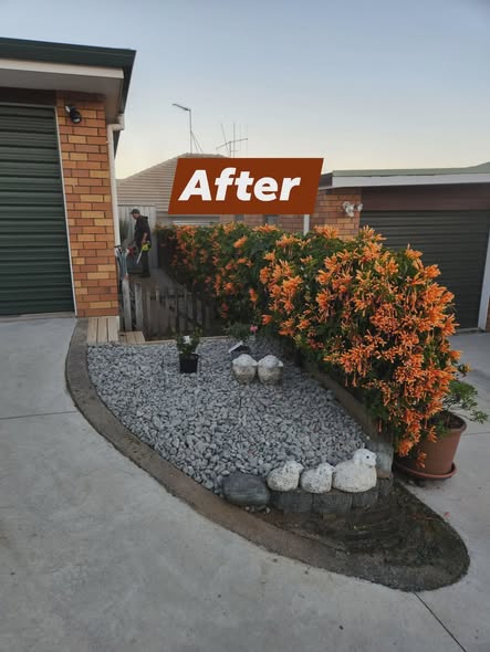 Same garden bed finished with grey stone, planting and a tidy edge