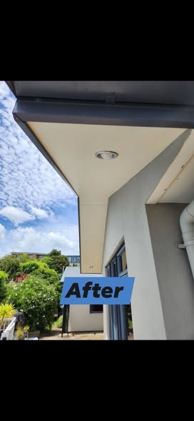 Cleaned soffit under a clear sky
